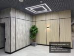 Отделка стен офиса Норникель декоративными панелями гипсокартон окрашенный под дерево, омега профиль